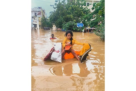Flood in Vijayawada: NDRF men evacuate people from a flood -hit area